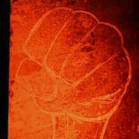 Chalk drawing of a fist at Croquemort’s performance.