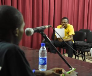 A participant reads his written text.