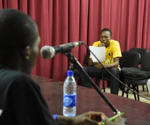 A participant reads his written text.
